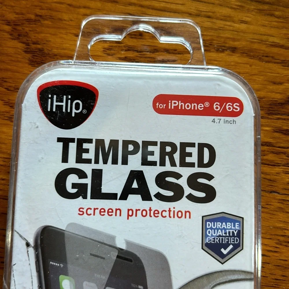 NWT. (New with tape intact). Never opened. Tempered glass iPhone 6/6s